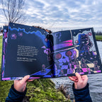 Open gothic storybook showing horror-inspired Wonderland artwork and text